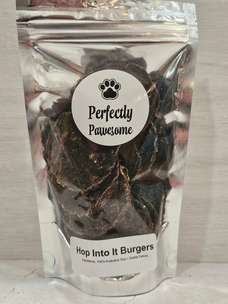 Dehydrated roo and rabbit patties for dogs in a Perfectly Pawesome zip lock pouch on a light gray background
