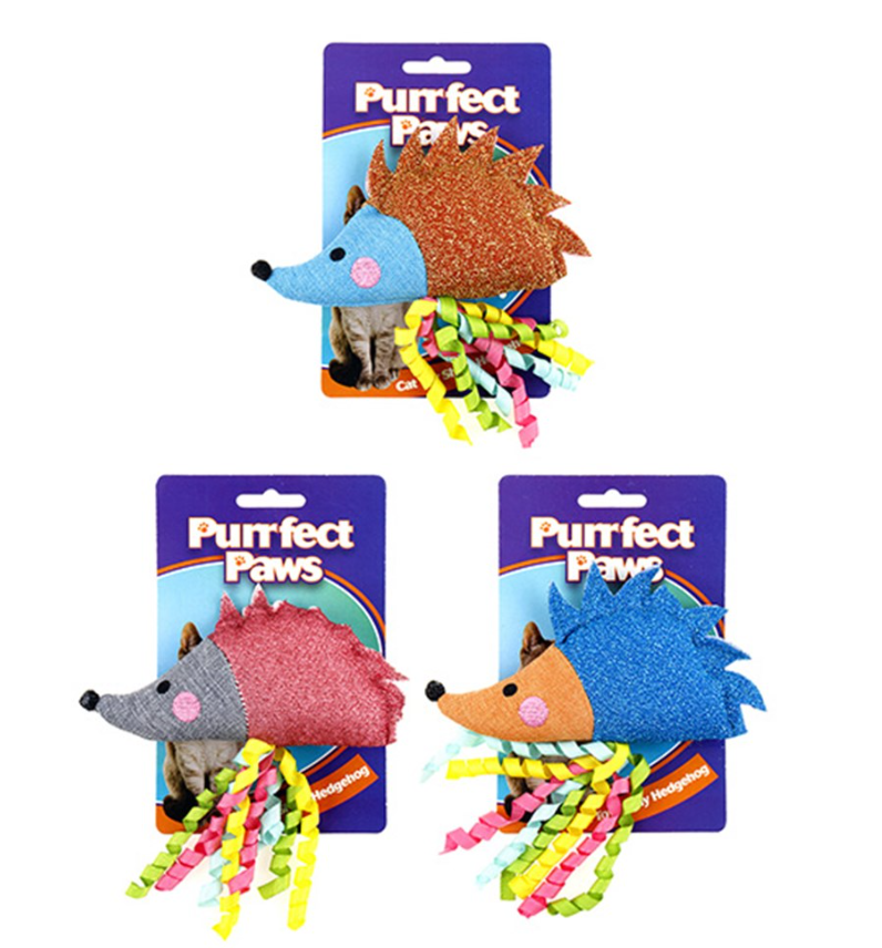 Three colorful hedgehog-shaped pet toys with ribbons on 'Purrfect Paws' packaging.