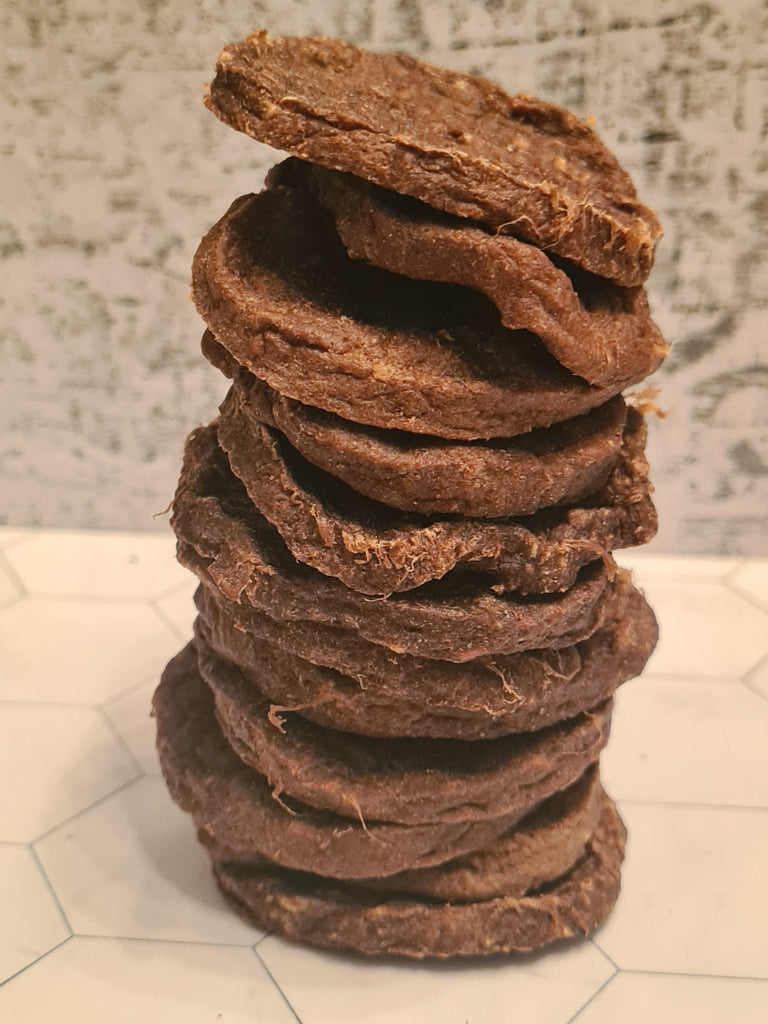 stack of outback coat of arms aussie burgers made from emu and roo patties (with chia and cranberry) for dogs