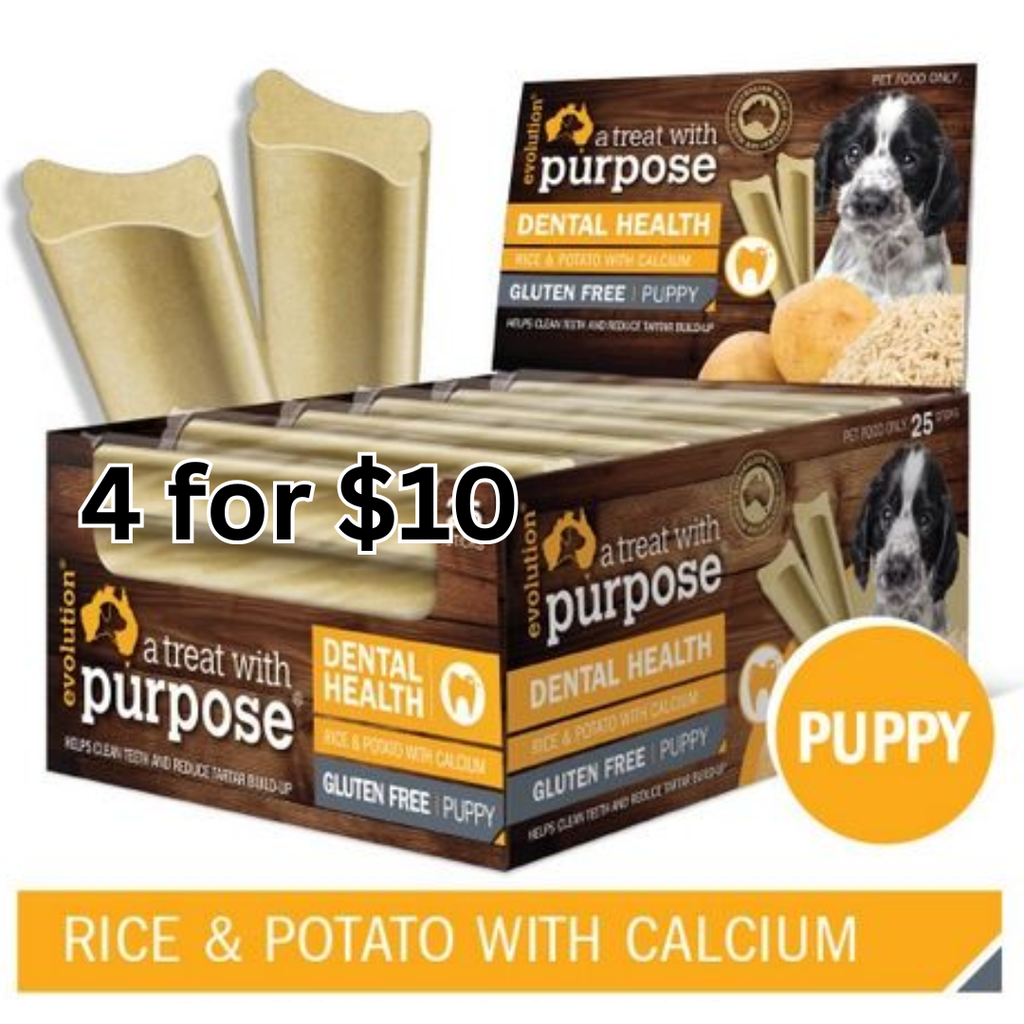 Box of 'A Treat with Purpose' dental health dog treats for puppies with promotional text.