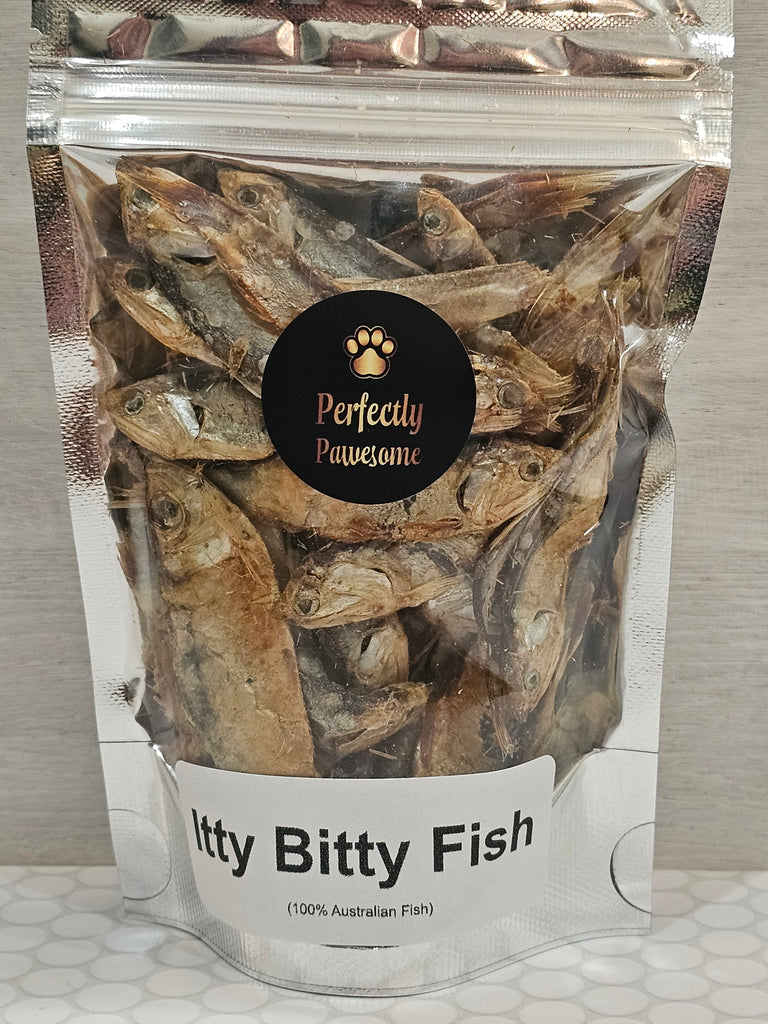 Package of dried fish labeled 'Perfectly Pawesome' on a textured surface.